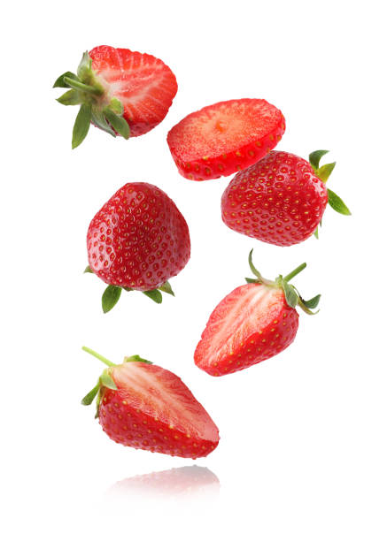 istock Fresh ripe strawberries falling on white background 1885454272
