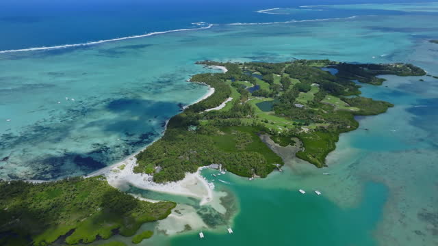 Aerial drone view of Ile Aux Cerfs, Flacq, Mauritius island, Indian Ocean. View of the white sanded beach in the tropical island. Summer holidays destination. Picturesque view of exotic landmark.