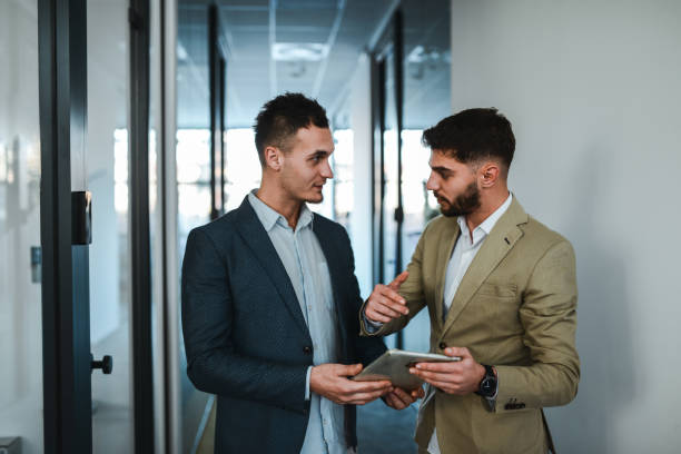 istock Businessman Offering Advice To Colleague 1885456444