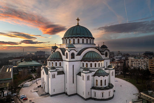 Majestic temple of St. Sava captured with a drone during sunset hour in the city of Belgrade.