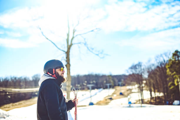 istock Middle age bearded man skiing on a ski slop in winter 1885476241