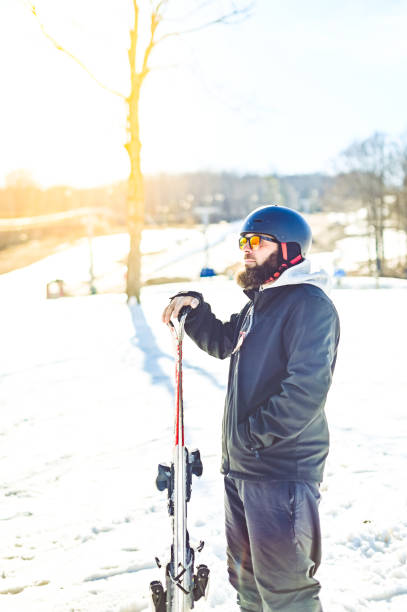 istock Middle age bearded man skiing on a ski slop in winter 1885483118