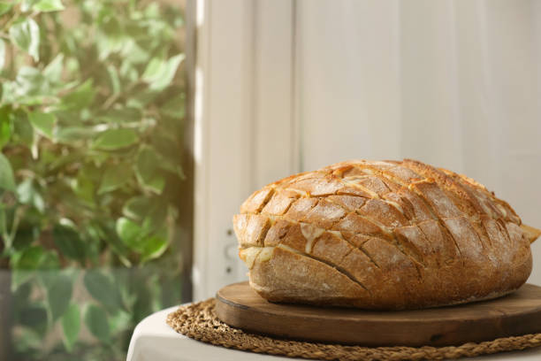 istock Freshly baked bread with tofu cheese on table indoors. Space for text 1885487237
