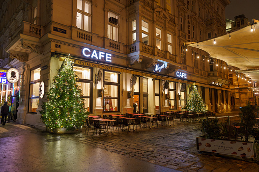 Vienna, Austria - 13 December 2023: The facade of the famous 1899 historic elegant Mozart café in the center of Vienna before Christmas