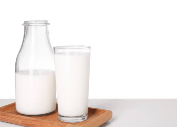 istock Glassware with tasty milk on light table against white background 1885516186