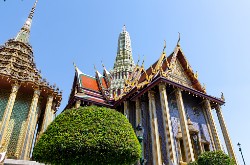 A stunning image of the Grand Palace in Bangkok, showcasing its intricate architecture and grandeur. This iconic landmark, with its golden spires and ornate details, stands as a symbol of Thai culture and history, reflecting the splendor of Thailand's royal heritage.