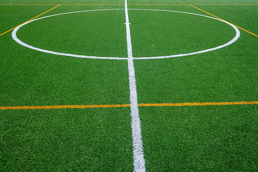 detail of the surface of an artificial grass football field