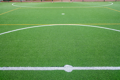 detail of the surface of an artificial grass soccer field
