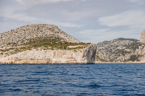 Island in the Mediterranean Sea with high cliffs.