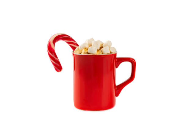 istock Hot drink with marshmallows and candy cane in a blue cup isolated on a white background.Cozy seasonal holidays.Hot cocoa with gingerbread Christmas cookies.Hot chocolate with marshmallow and spices. 1885564627