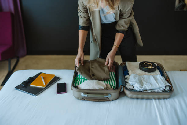 istock Anonymous Woman Packing Things in the Suitcase 1885589867
