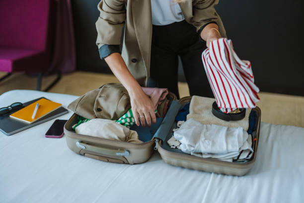 istock Anonymous Woman Packing Things in the Suitcase 1885589869