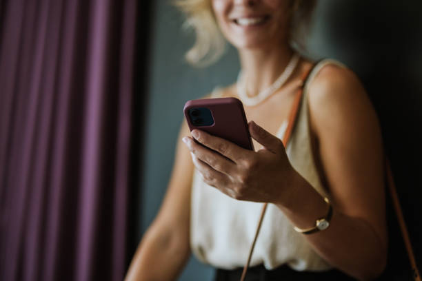 istock Unrecognizable Woman Holding Mobile Phone and Texting 1885590408