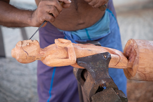 Kolutara, Sri Lanka 09 february 2023. Sri Lankan Traditional wood craft and craftsmen. small private workshop-shop for making handmade souvenirs from wood. Animal figurines, mascs and Buddha image.