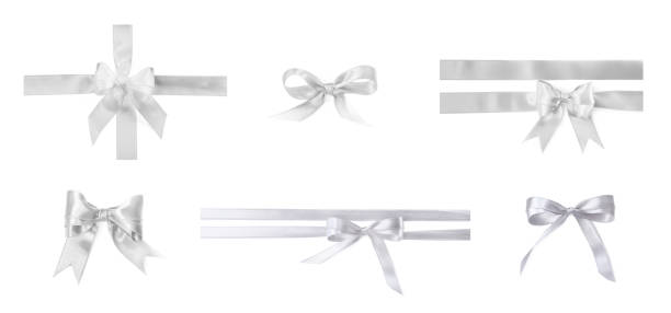 istock White satin ribbon and bows isolated on white, set 1885657826