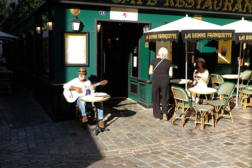 Lisbon, Portugal - April 2, 2022: A group of college students performs at the Rua Augusta street in Lisbon downtown.