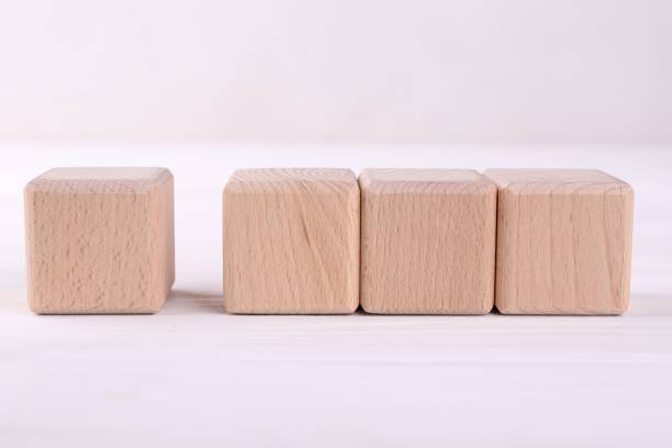 istock International Organization for Standardization. Wooden cubes with check mark and abbreviation ISO on white table 1885695162