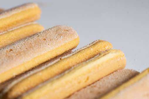 Lady finger biscuits, Italian dessert and sponge cookie on white background