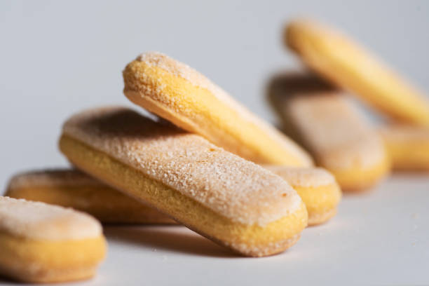 Lady finger biscuits, Italian dessert and sponge cookie on white background
