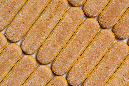 Italian sponges fingers. Italian sweet biscuit background pattern