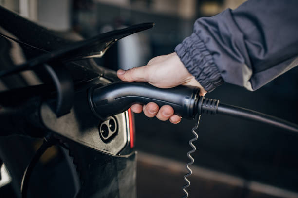 istock Power cable charging power to electric vehicle 1885731973