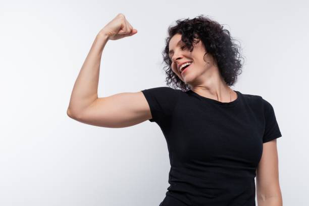 istock Strong brunette with curly hairstyle wearing a basic t-shirt 1885871559