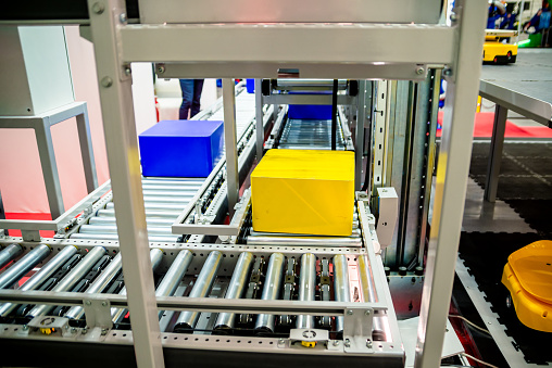 Warehouse automation. Automated conveyor lines with robotic manipulator.