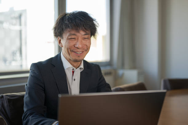 istock Business man with laptop 1885905204