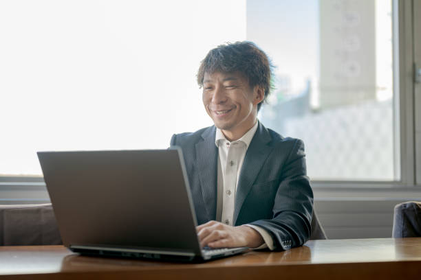 istock Business man with laptop 1885905211