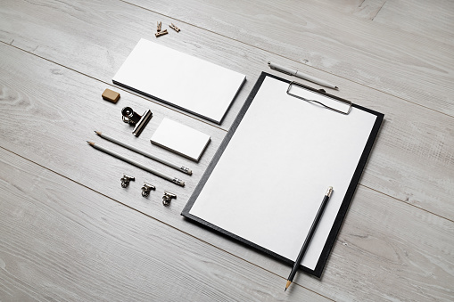 Blank corporate stationery template on wooden background. Mock up for design portfolios.