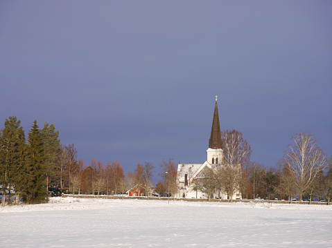 View of a church on a field at winter