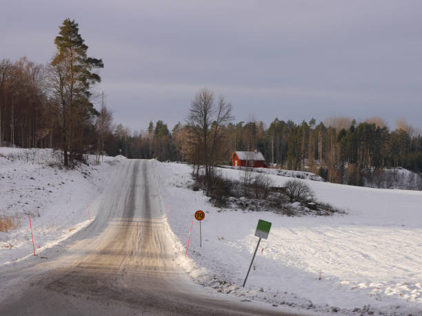 istock View of a country road during winter 1886011444