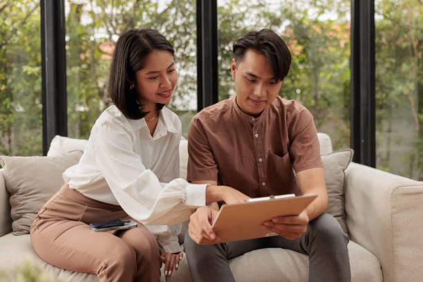 istock Real estate agent talks terms with homebuyers 1886097778