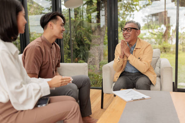 istock Real estate agent thanks clients for for contract achievement 1886098800