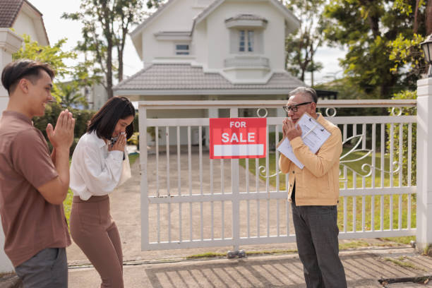 istock Real estate agent greets prospective buyers 1886101875
