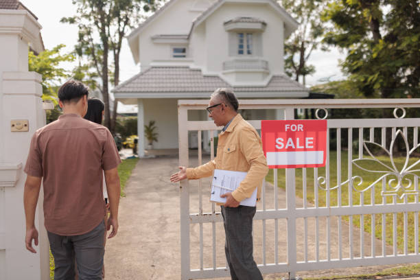 istock Real estate agent welcomes prospective buyers 1886101880