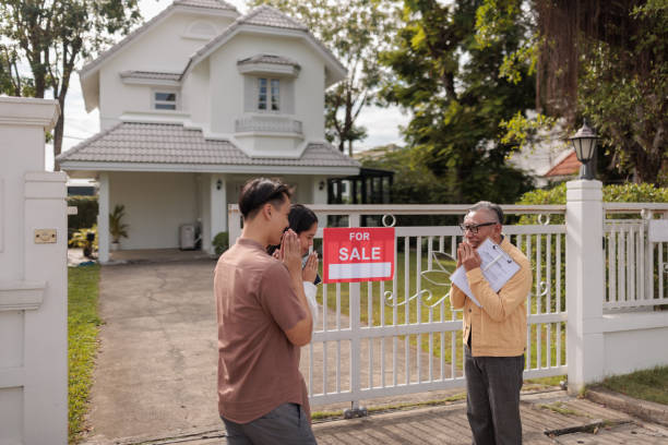 istock Real estate agent greets prospective buyers 1886101887