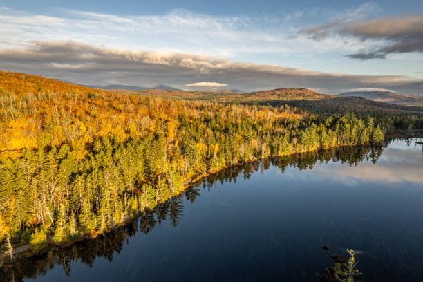 istock Tranquil quiet lake at sunrise in fall near Millinocket, Maine. 1886186749