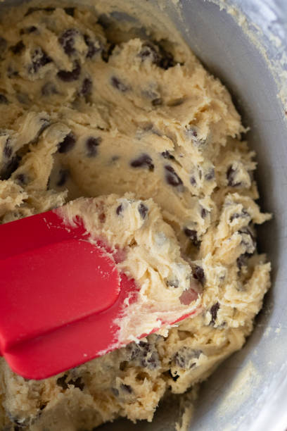 istock close-up of chocolate chip cookie dough and a red spatula 1886187778