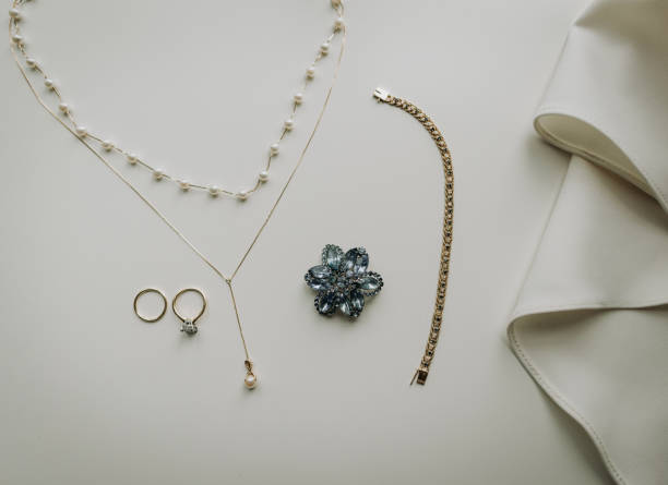 istock Wedding rings necklace and jewelry on a white surface 1886192400