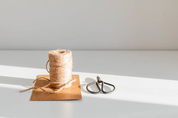 istock roll of twine with black scissors for packaging 1886198085