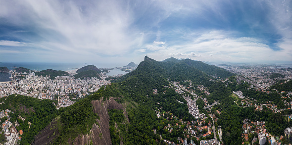 Beautiful view to mountains, green rainforest and city buildings in Rio de Janeiro, State of Rio de Janeiro, Brazil