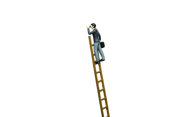 istock Miniature tiny people toy figure photography. Businessmen climb the ladder using binocular telescope. Isolated on a white background 1886201301
