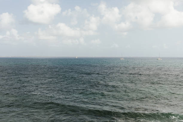 istock Three Sailboats off of the Coast 1886201352