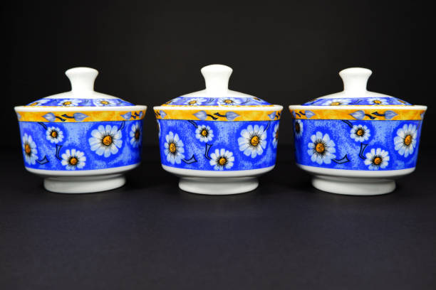 Floral pattern traditional jars together isolated on dark background close-up view group of objects