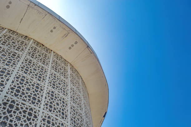 istock modern minimalist mosque with bright blue sky background 1886249648