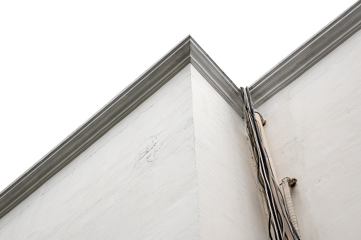 Closeup view of stripes decoration on the white wall. Building feature