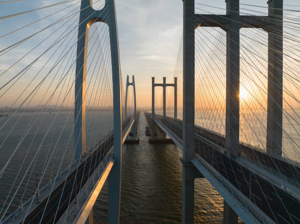 istock Cross-sea bridge sunrise landscape 1886360386