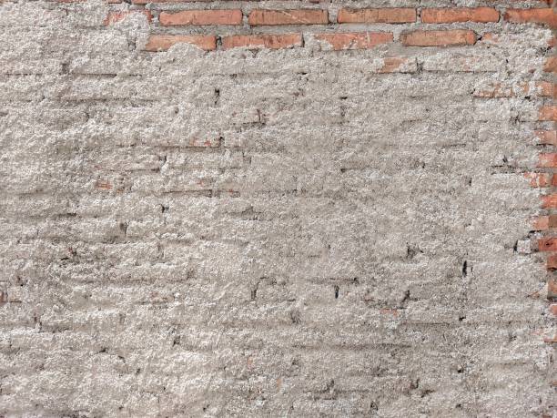 istock Background texture of unfinished concrete wall, brick wall 1886363463