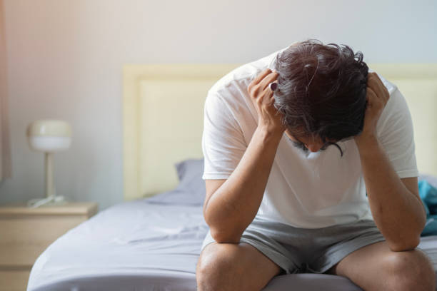istock Sleepless, man suffering from insomnia, sleep apnea or stress. Tired and exhausted guy. 1886412263